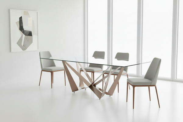 Modern glass dining table with metal legs in a minimalistic room.